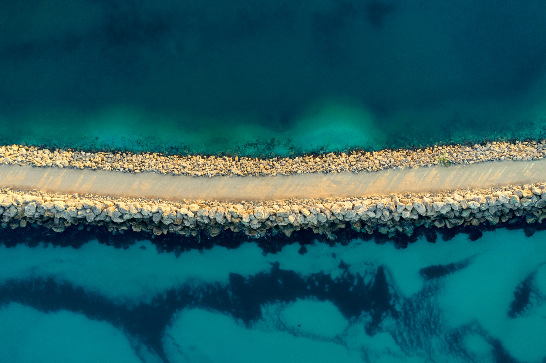 View of Rocky Groyne Path Thru Ocean Waters